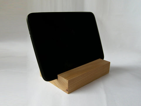 Large tablet on display in wooden stand